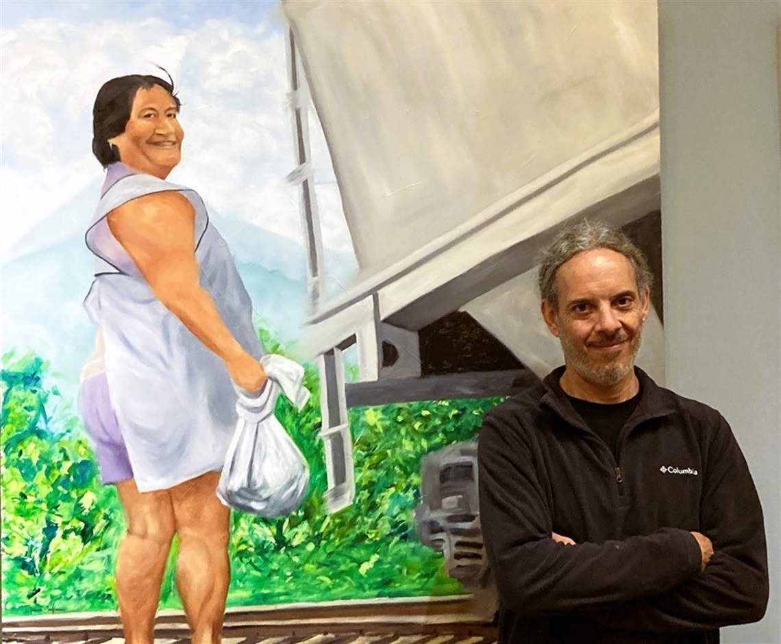 Artist with painting of lady